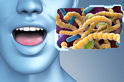 The image is a digital graphic featuring a human head with an open mouth, displaying a yellowish substance that resembles bacteria or germs. On the right side of the image, there s an inset picture showing a microscopic view of cells and what appears to be a virus or pathogen.